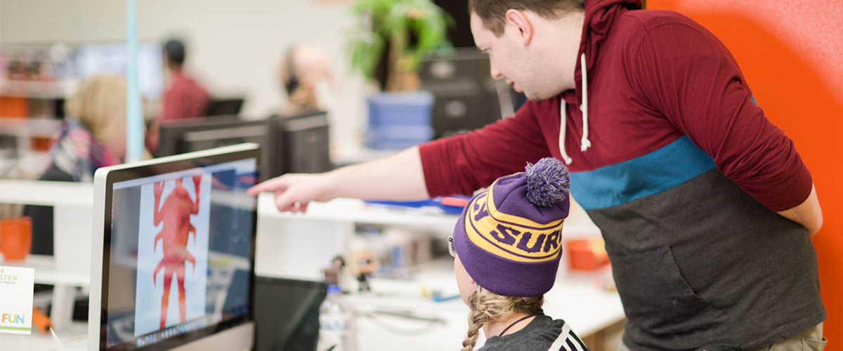 Two people reviewing an image of one of our products